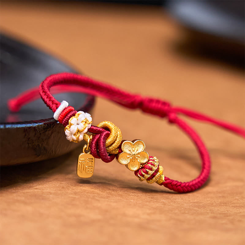 Handwoven with red cord, adorned with a golden peach blossom and a "Fu" (blessing) pendant, symbolizing love and good fortune. The exquisite design blends traditional auspicious meaning with modern style, making it a perfect accessory for daily wear.