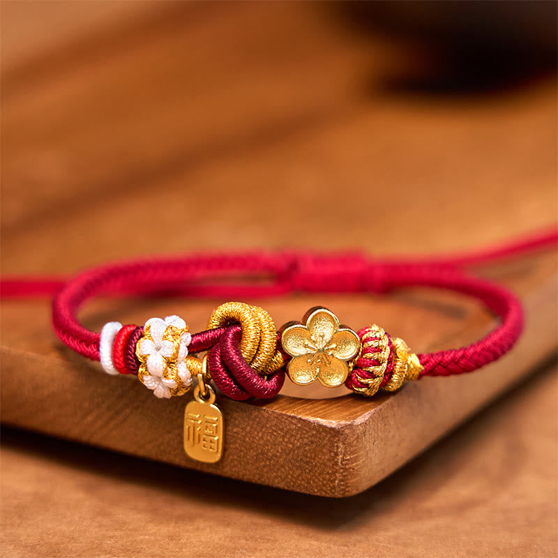 Handwoven with red cord, adorned with a golden peach blossom and a "Fu" (blessing) pendant, symbolizing love and good fortune. The exquisite design blends traditional auspicious meaning with modern style, making it a perfect accessory for daily wear.