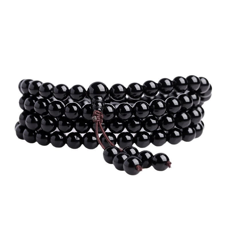 Black beaded bracelet on a white background