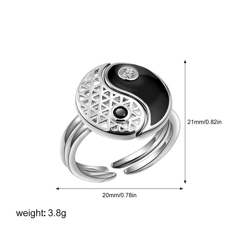 Silver ring with black and white design, showing measurements and weight on a white background
