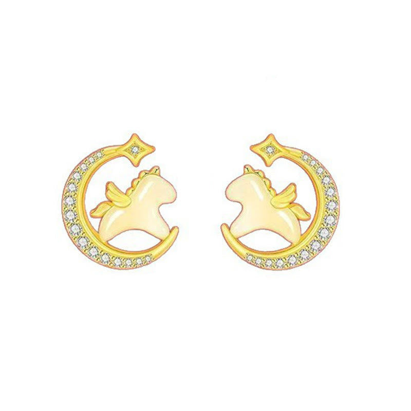 Gold earrings with a design of a horse on a crescent moon and star against a white background