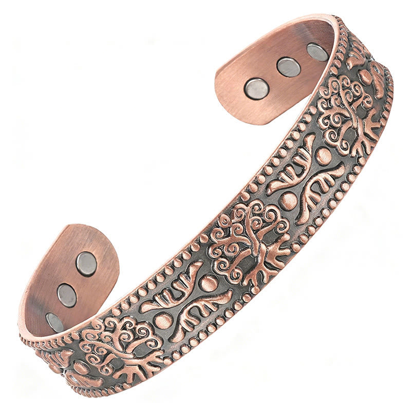 Decorative copper bracelet on a white background