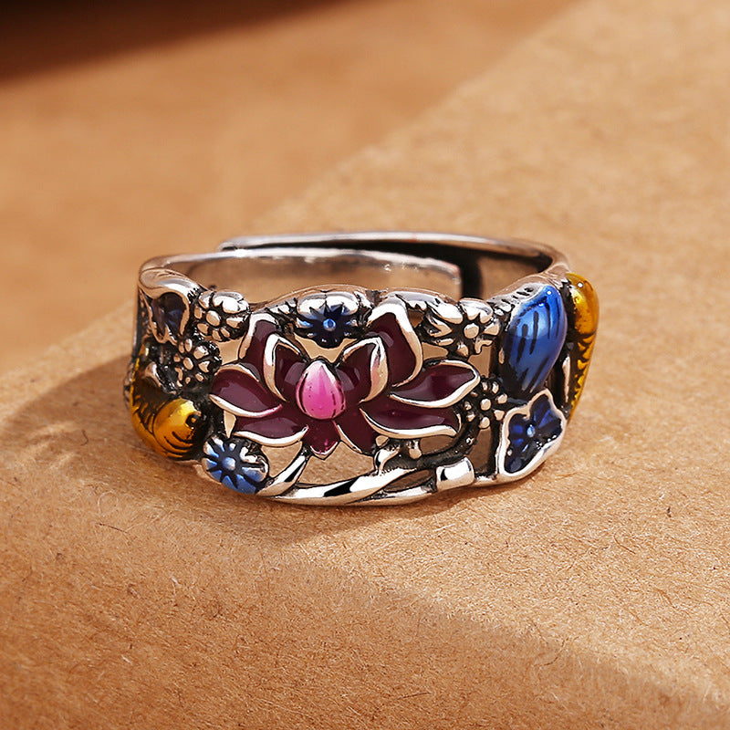 Decorative ring with floral designs on a brown surface