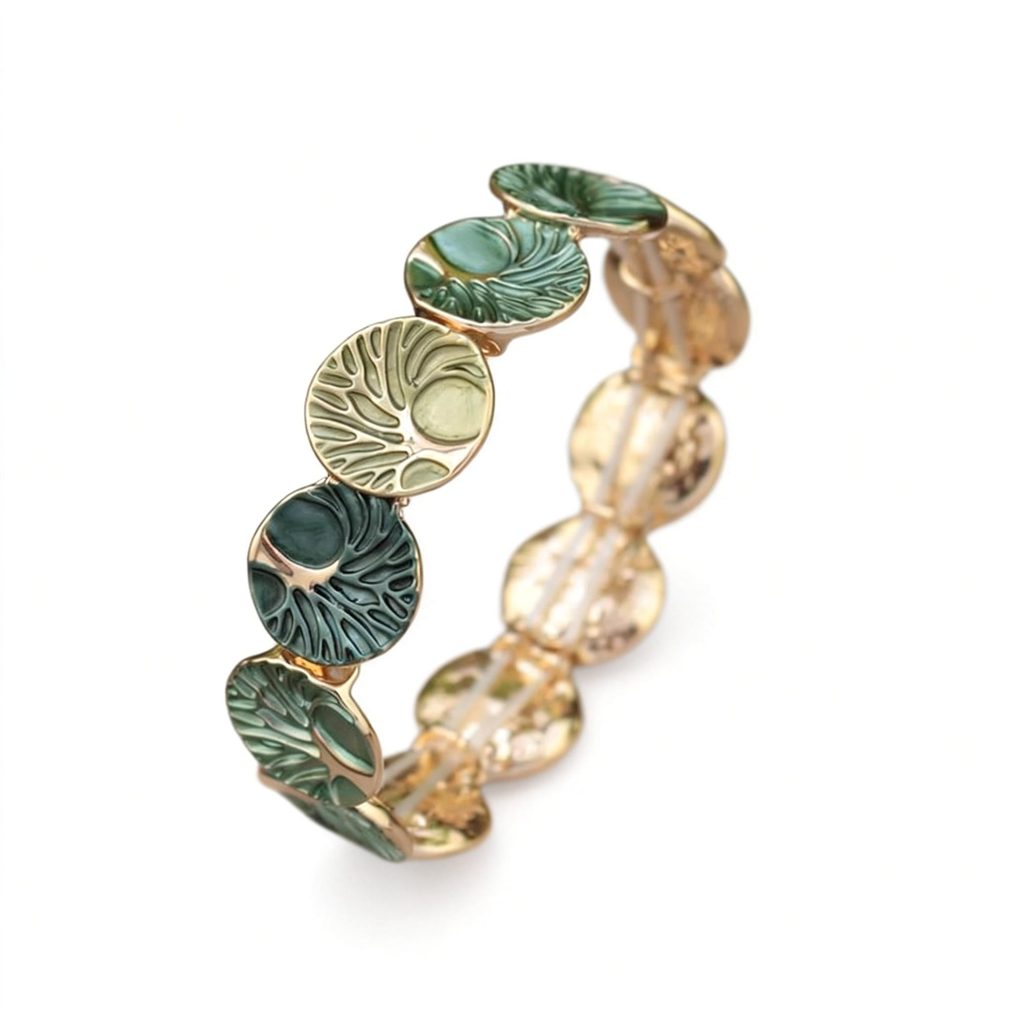 Gold and green beaded bracelet on a white background