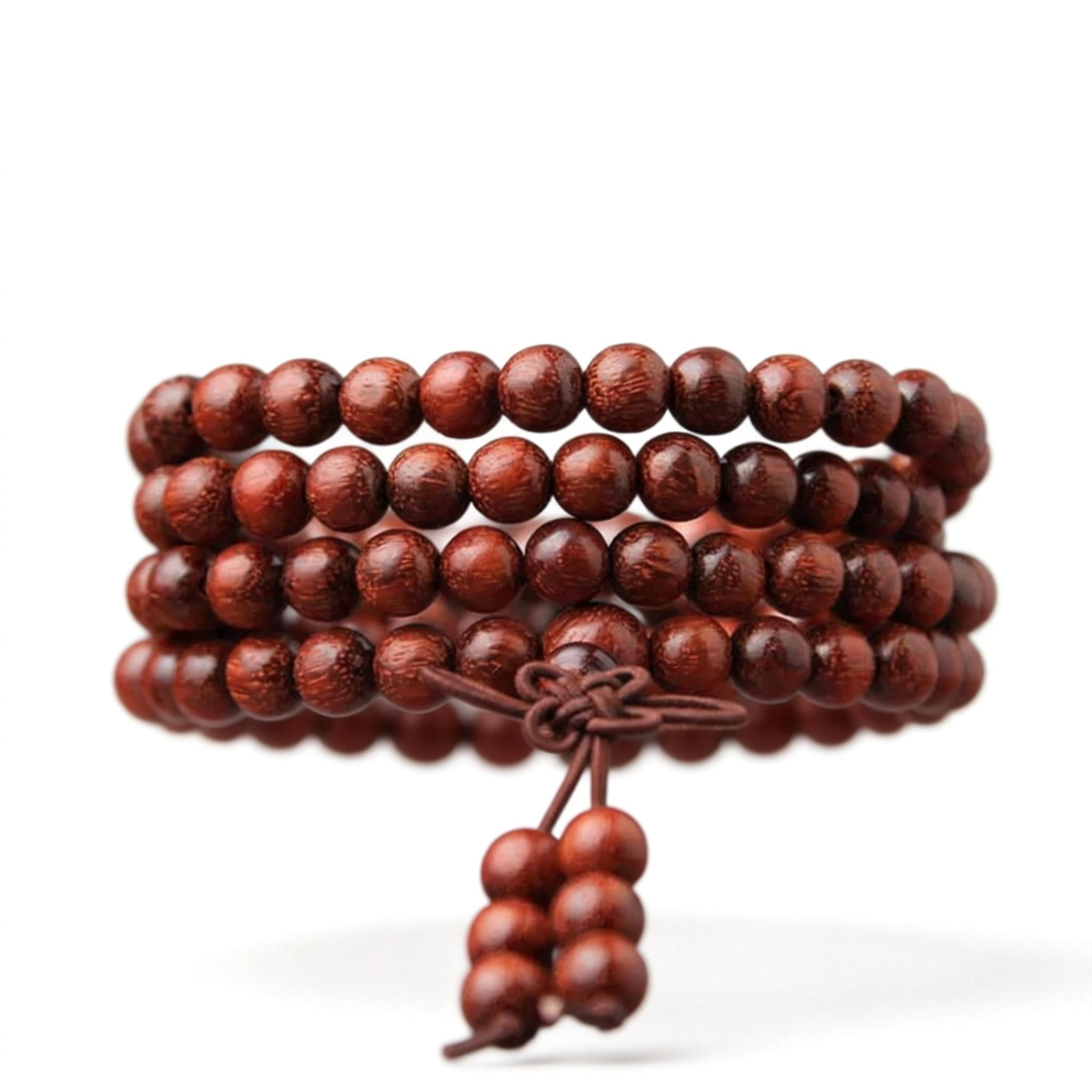 Stack of brown wooden beads on a white background