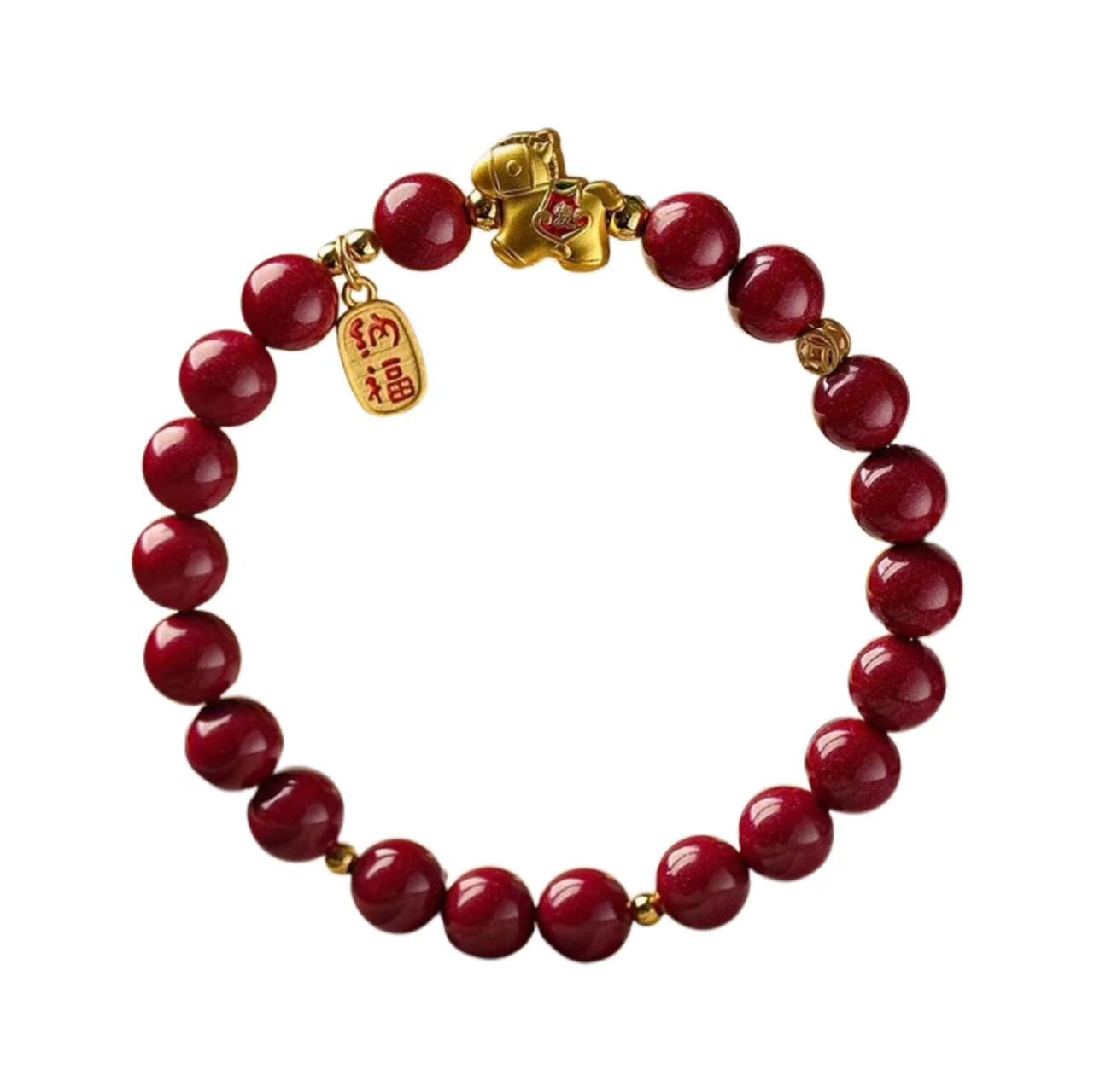 Red beaded bracelet with gold accents on a white background