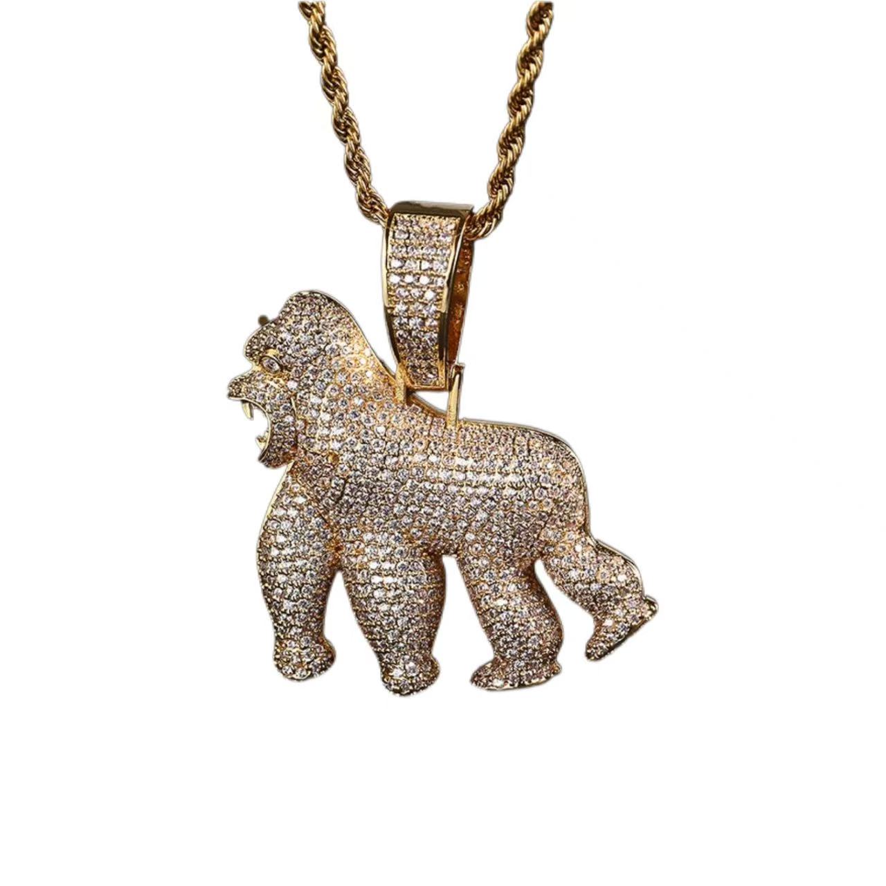 Gold gorilla pendant necklace on a white background