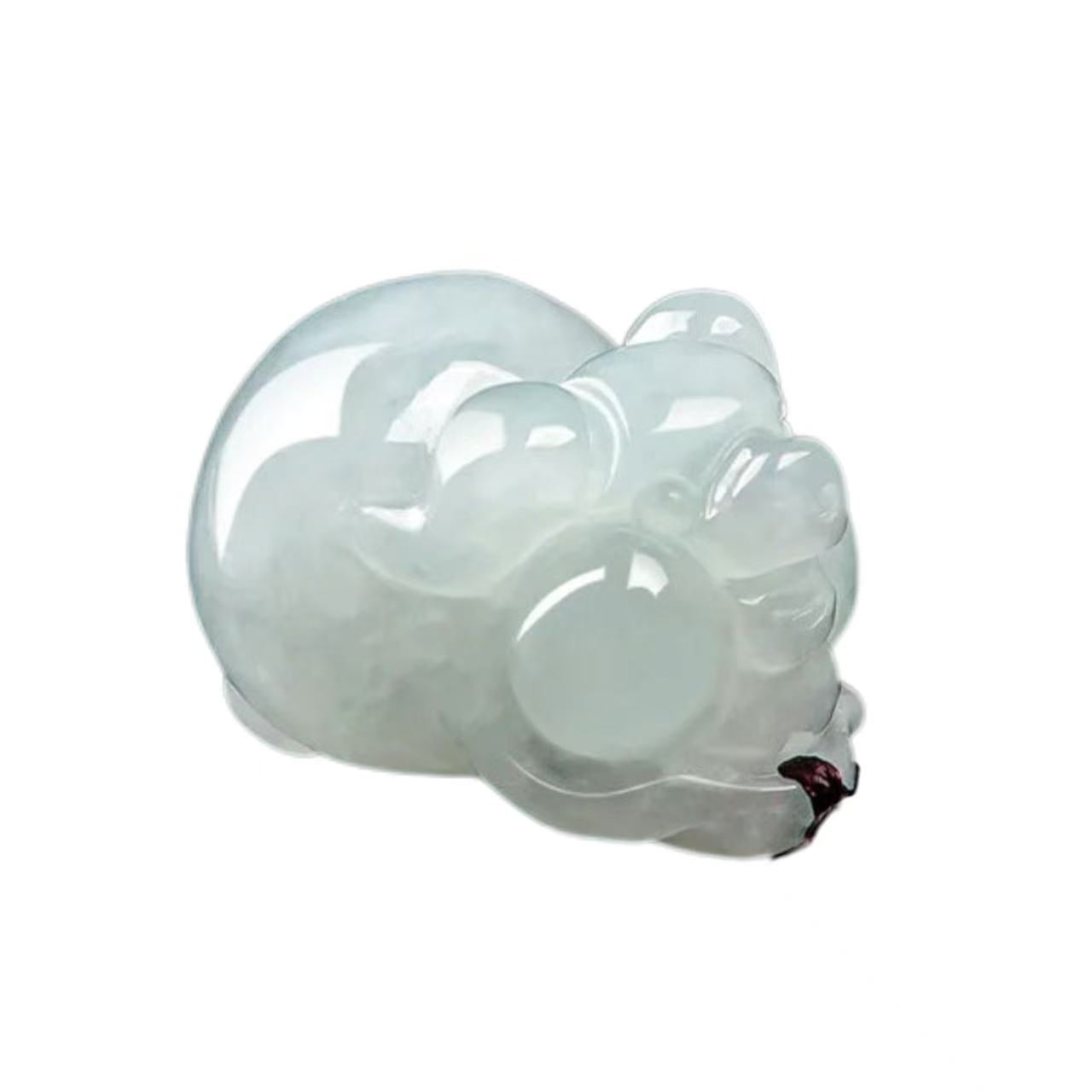 Translucent glass sculpture of a cat on a white background