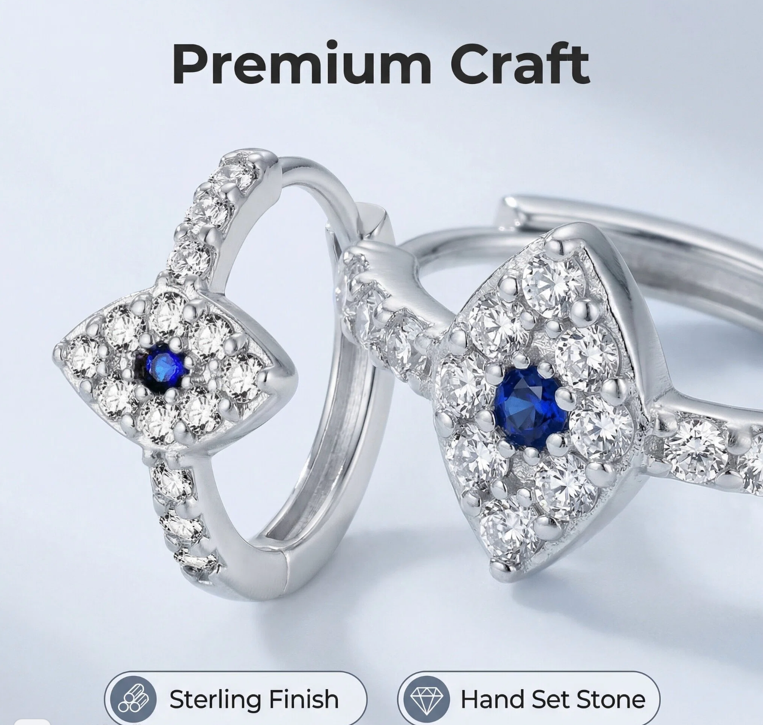 Silver earrings with blue gemstones on a light gray background, labeled 'Premium Craft'.