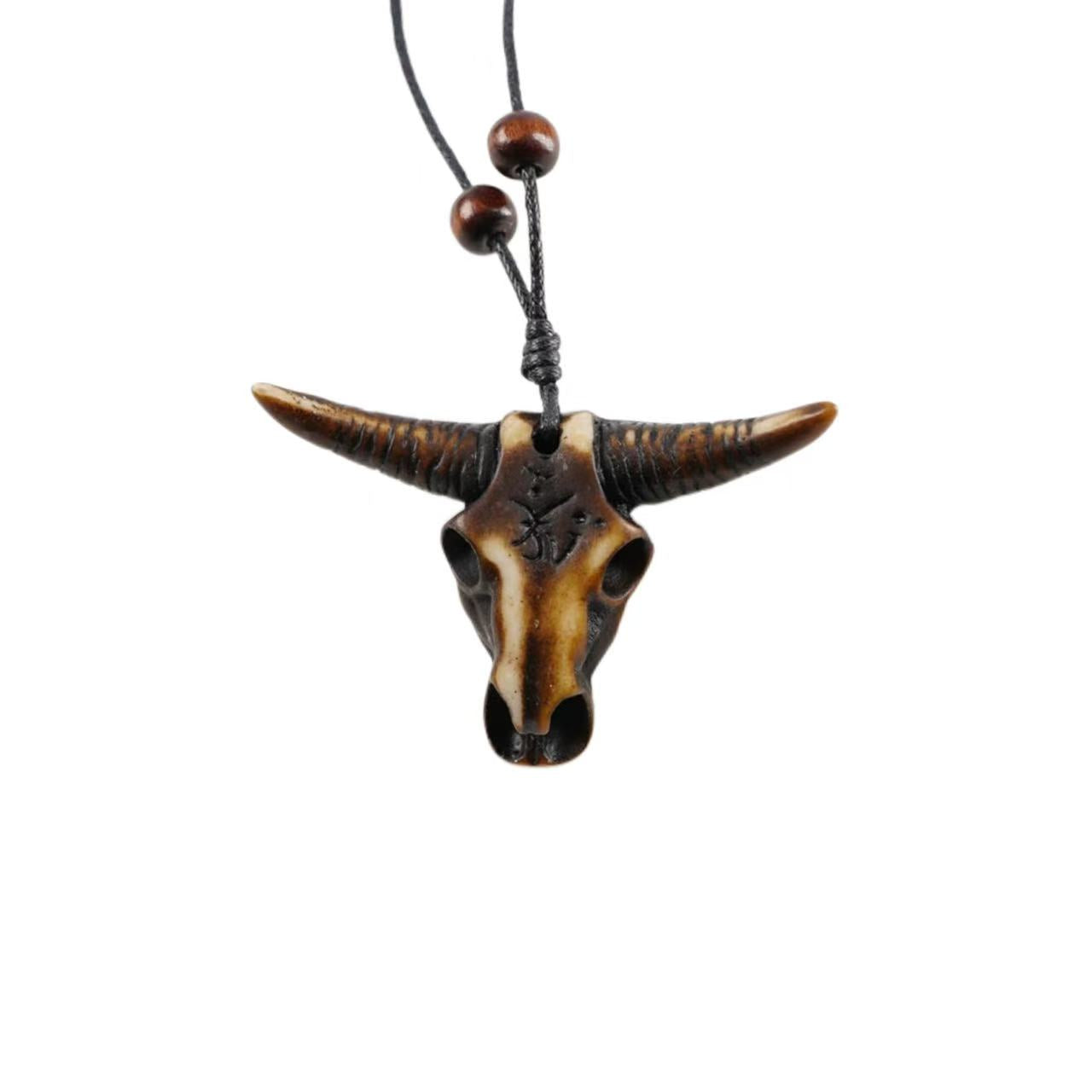 Necklace with a bull head pendant on a white background
