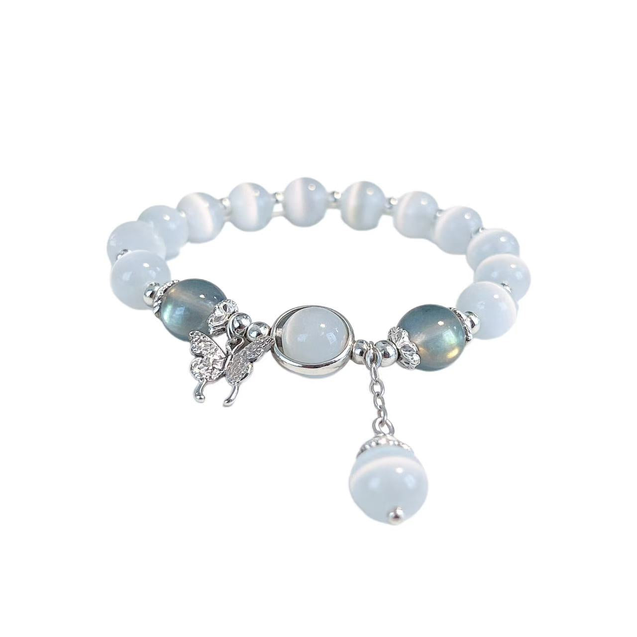 Beaded bracelet with charms on a white background