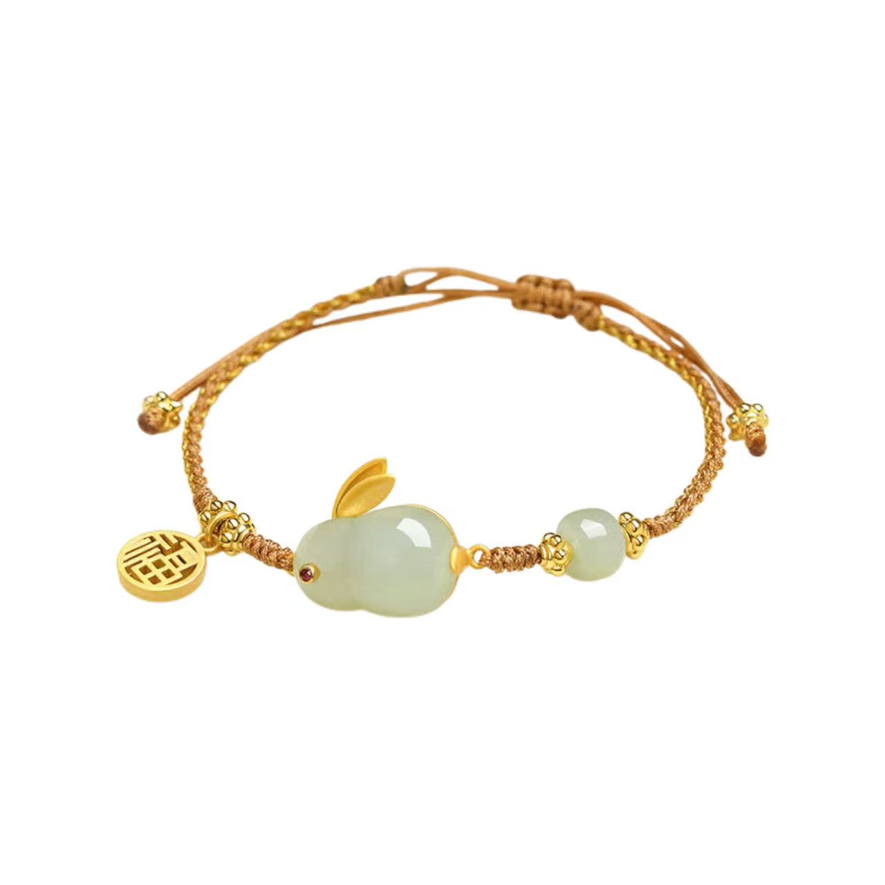 Gold bracelet with jade beads and a charm on a white background