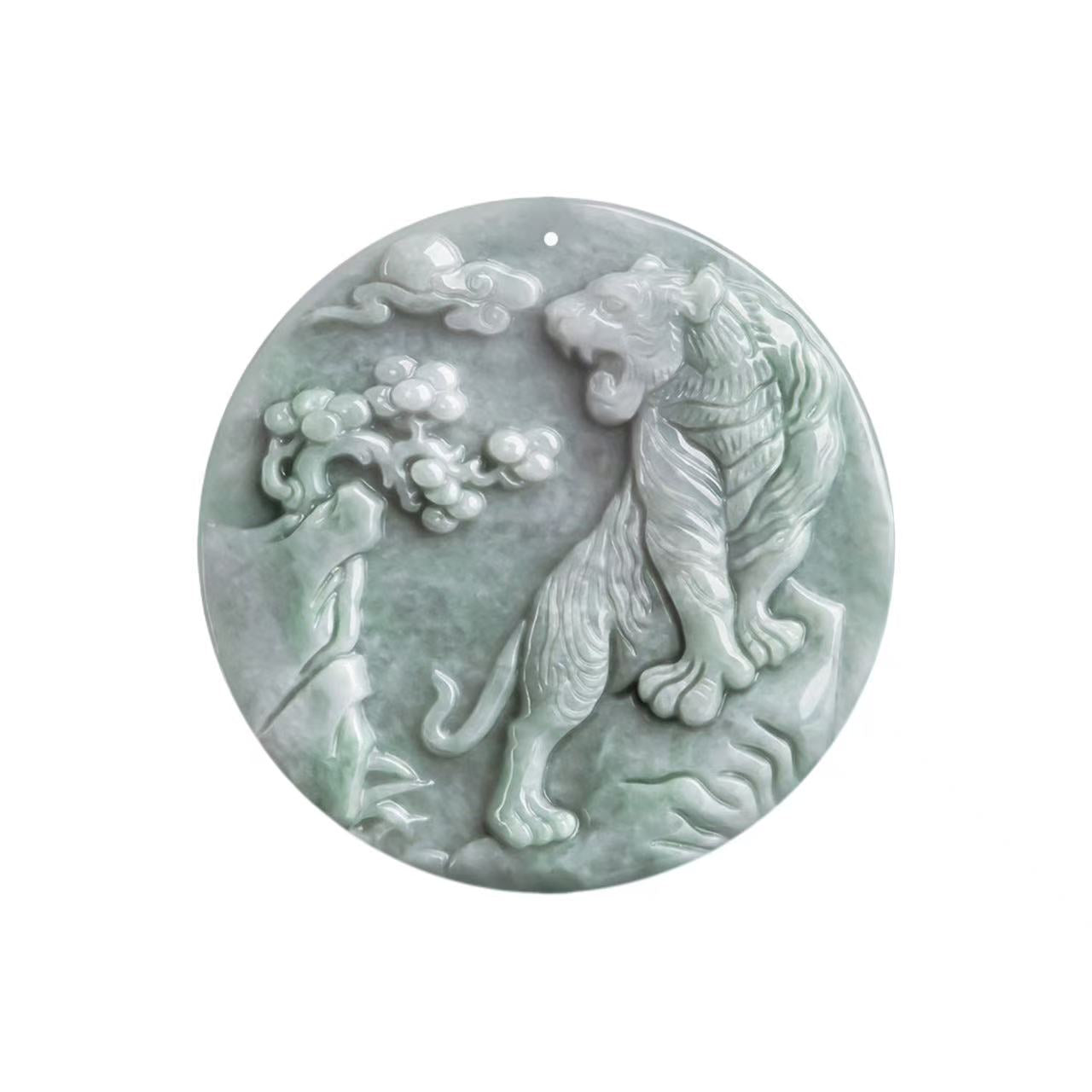 Decorative jade plaque with a tiger design on a white background
