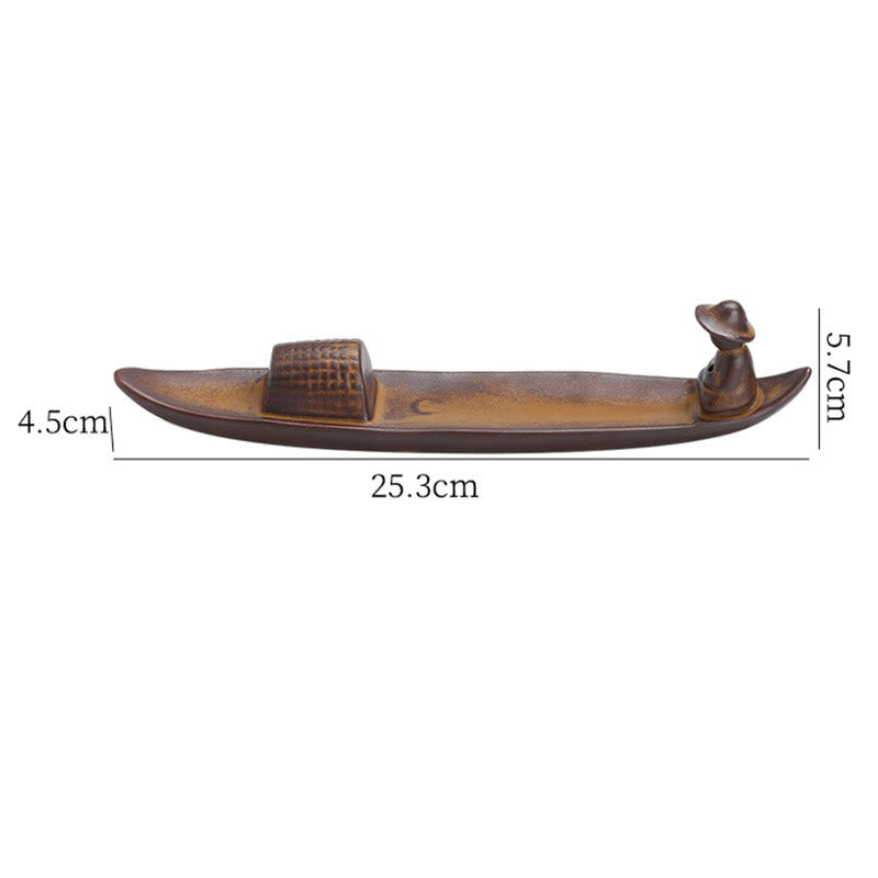 Wooden boat model with measurements on a white background