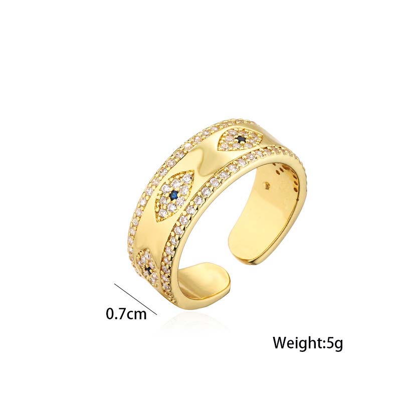 Gold ring with gemstones on a white background