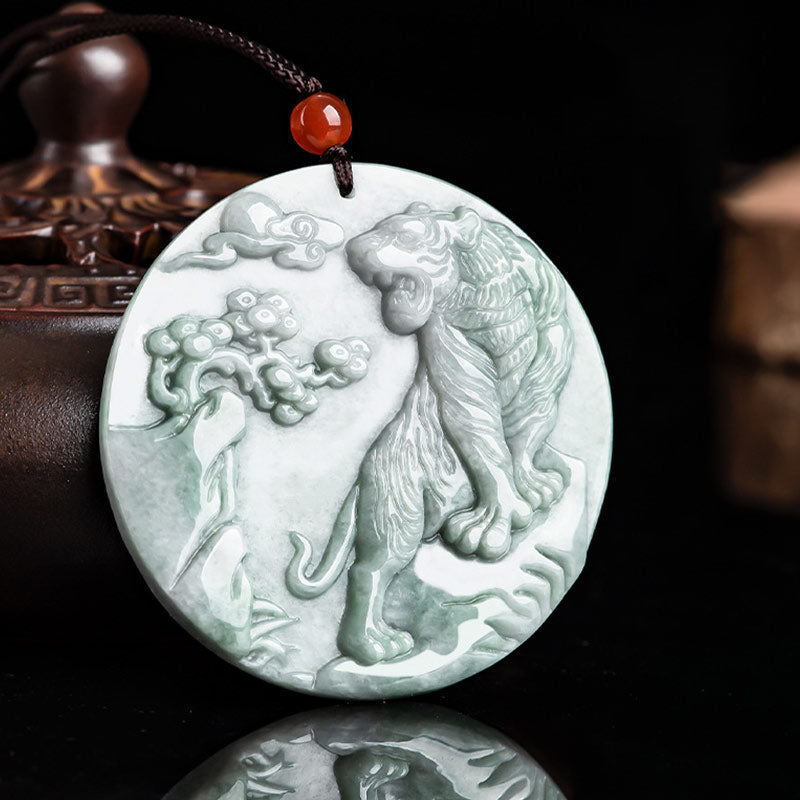 Carved jade pendant with a tiger design on a dark background