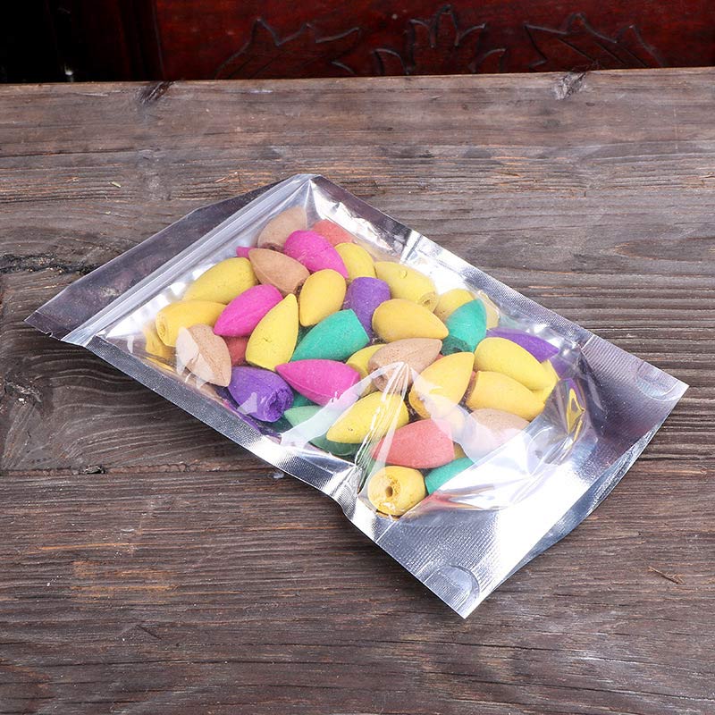 Colorful candies in a transparent packaging on a wooden surface