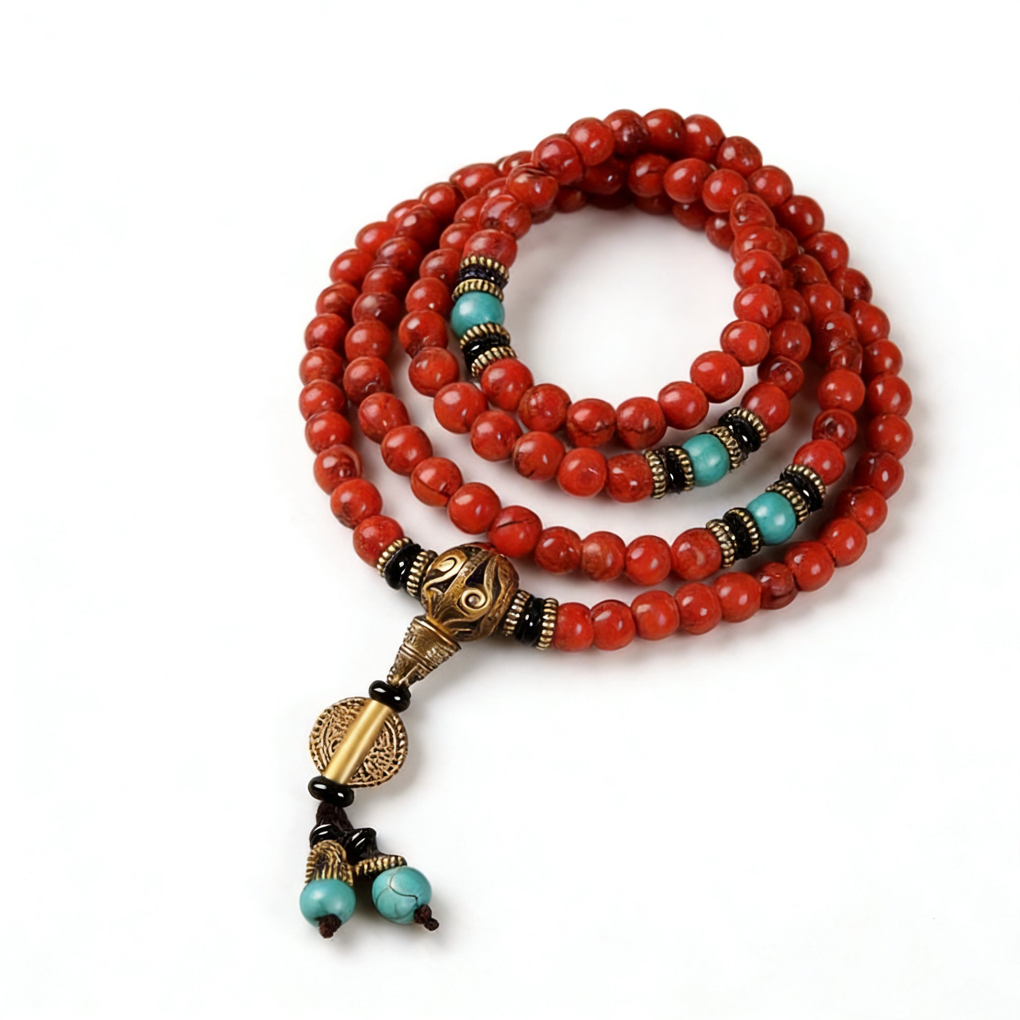 Red beaded necklace with green accents on a black stand, surrounded by natural wood elements on a beige background