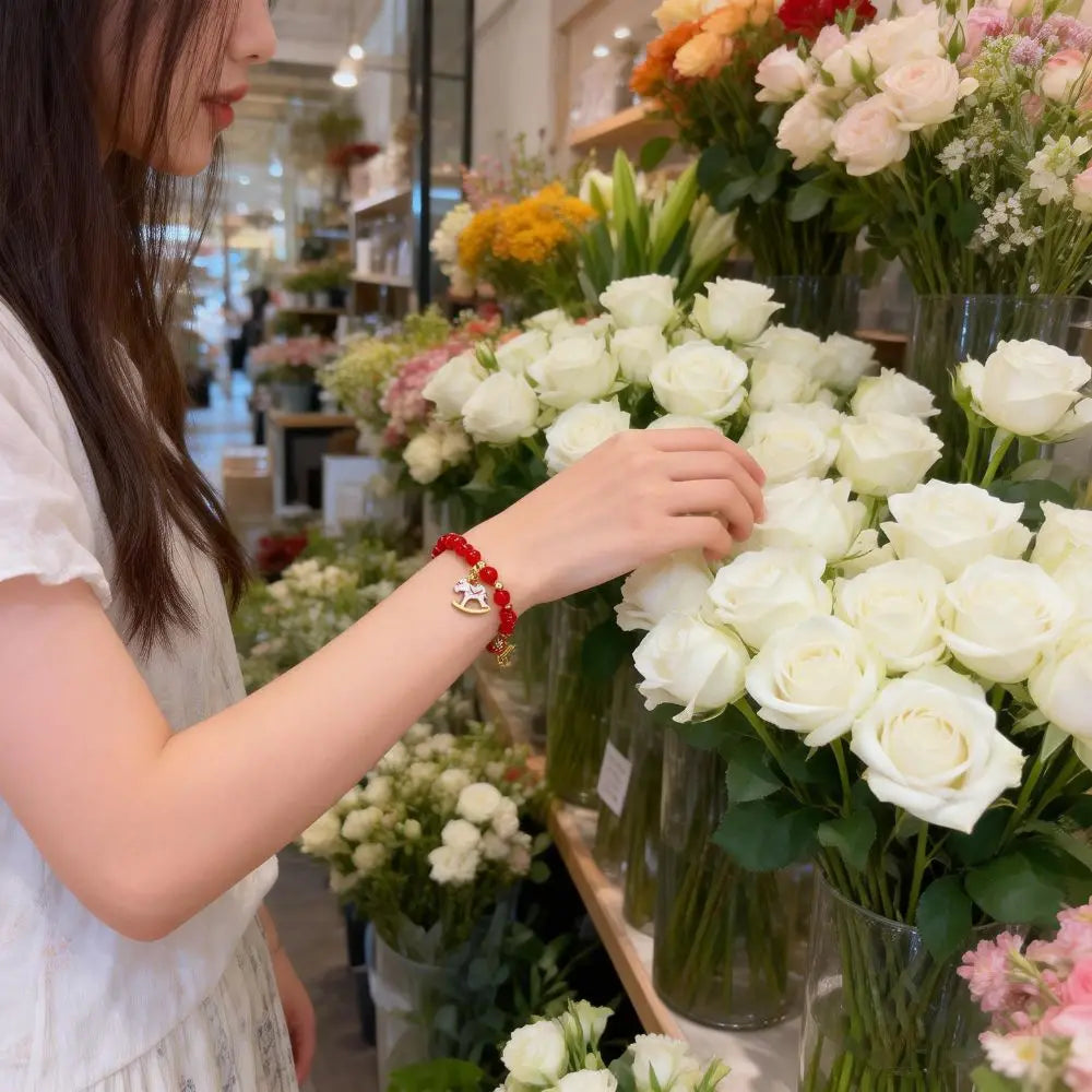Woman arranging flowers in a floral shop
