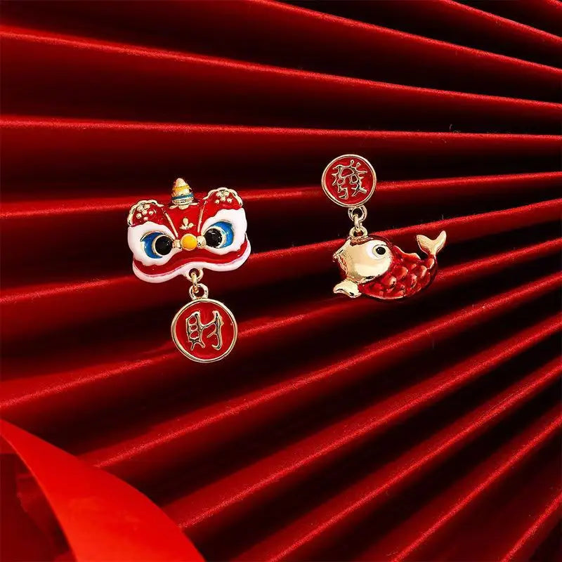 Two small decorative items on a red textured background