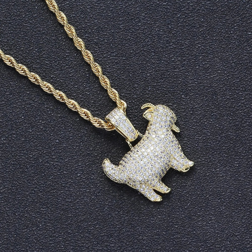 Gold dog-shaped pendant on a chain against a dark background