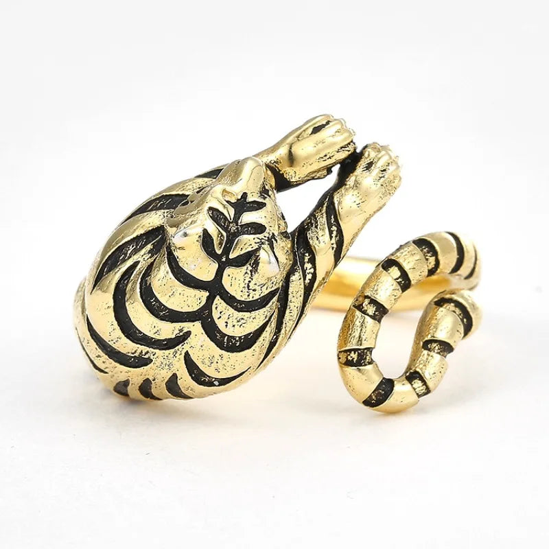 Gold snake-shaped ring on a white background