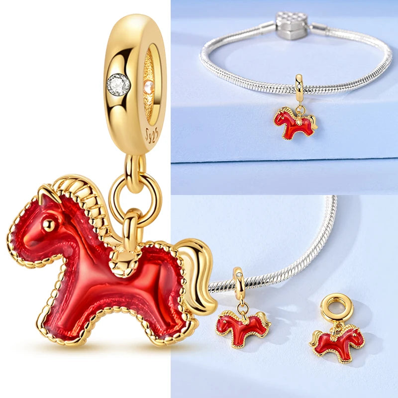 Red horse charm with gold accents on a white background, accompanied by a silver bracelet with a matching horse charm.