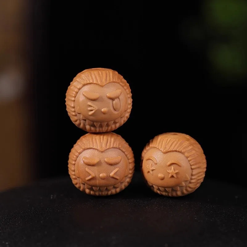 Three brown lion-shaped cookies on a dark background