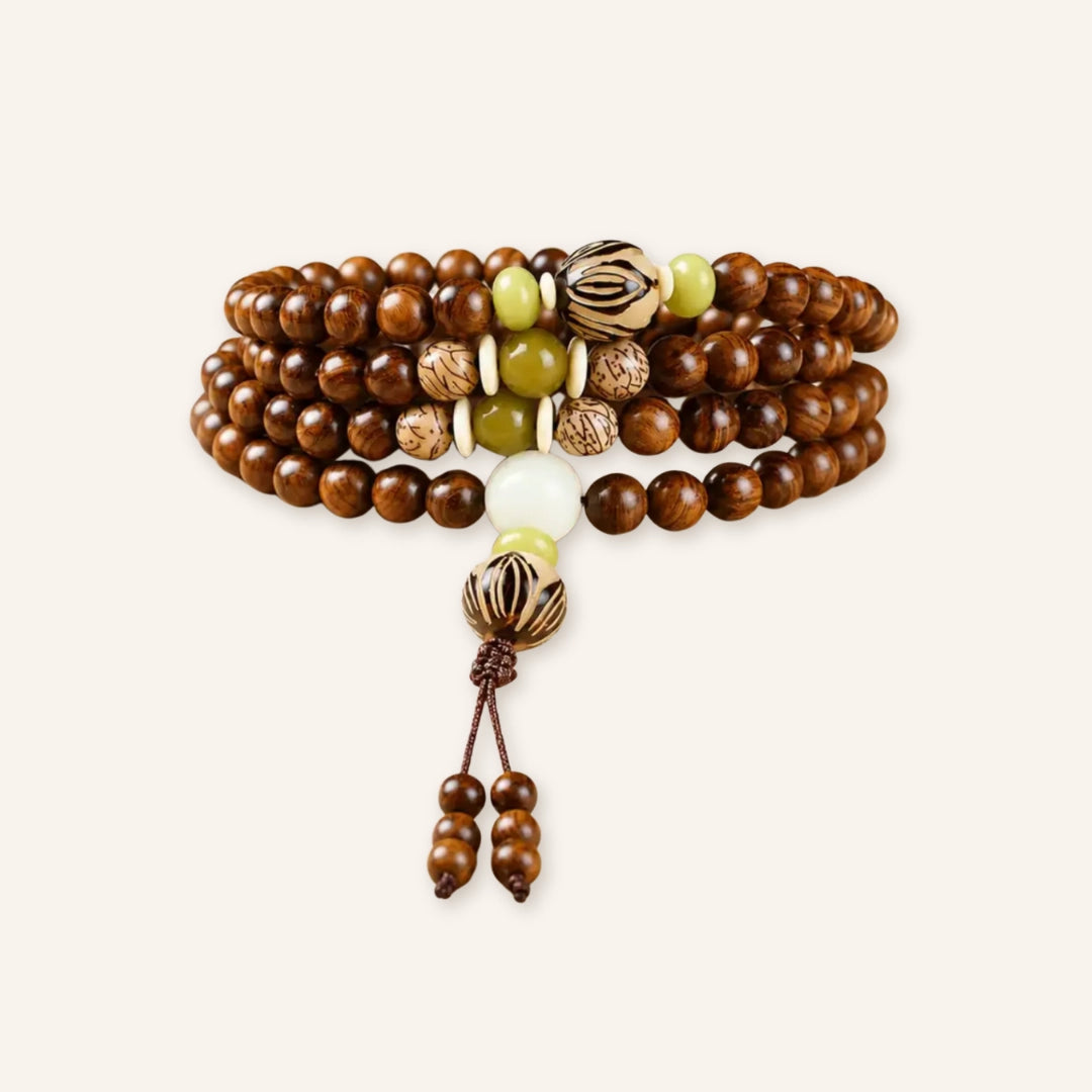 Steady Growth Rosewood 108 Mala featuring natural rosewood beads in a 108-bead design that can be worn long or wrapped in a clean product image.