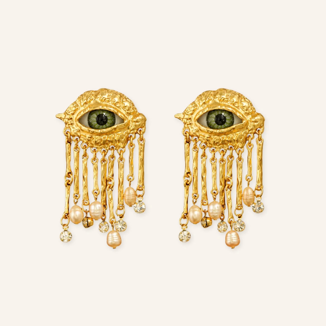Vintage Protective Evil Eye Earrings featuring gold-tone evil eye drops, dangling tassel chains, pearl accents, and sparkling crystal details in a clean product image.