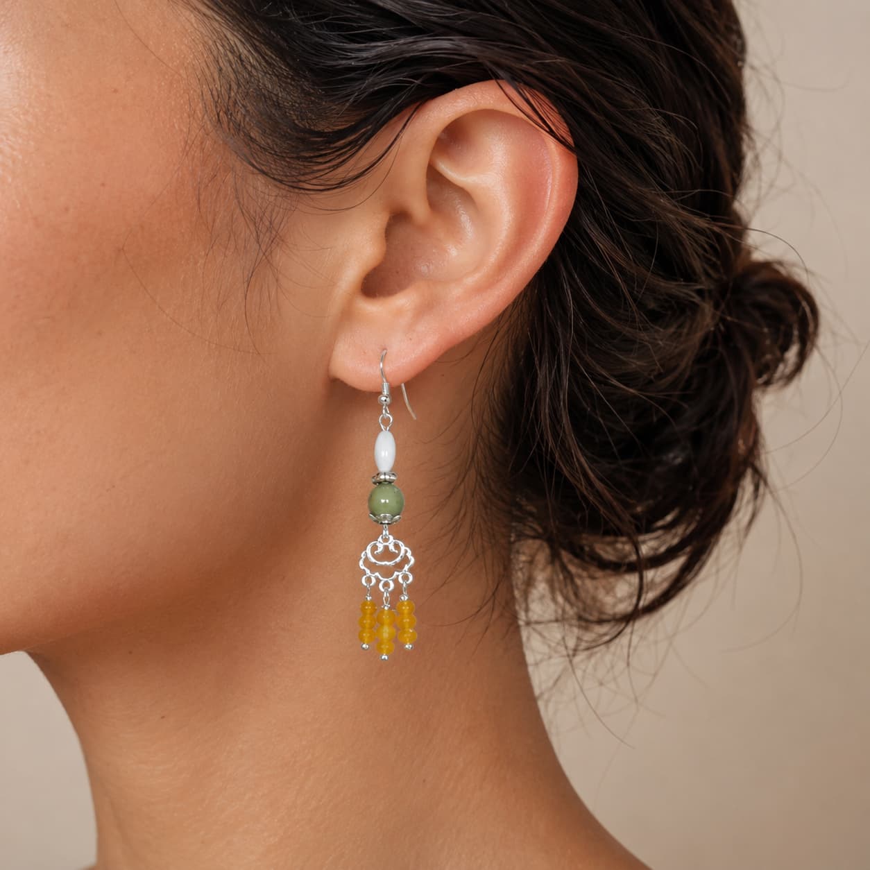 Close-up of Agate Shell Tassel Earrings with agate and chalcedony