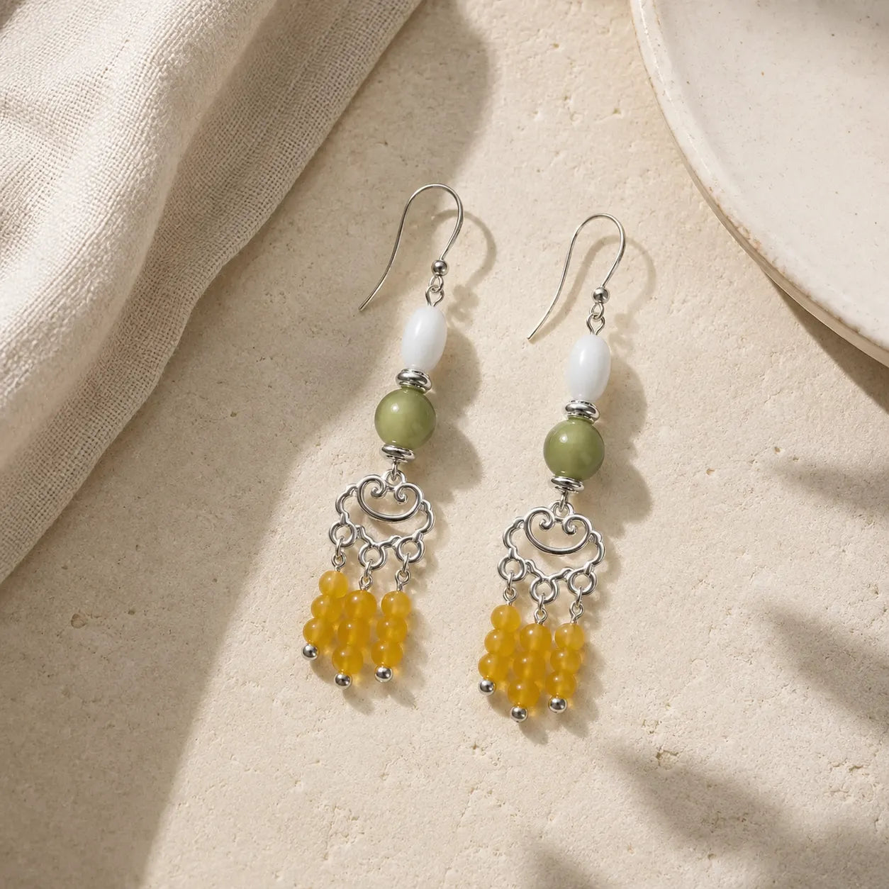 Agate Shell Tassel Earrings detail view with agate and chalcedony