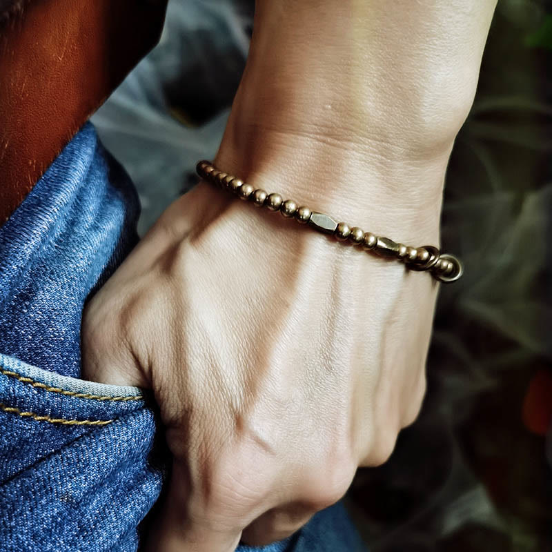 Lifestyle photo of copper brass bracelet representing balance and grounded style – TheFuMaster