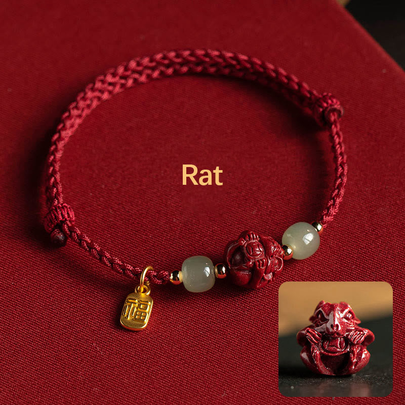 Red bracelet with charms on a red background, featuring a small inset image of a rat figure.