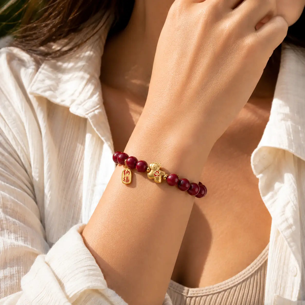 Cinnabar Horse Fu Bracelet shown from alternate angle with red bead detail