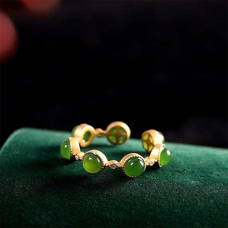Side view of Cyan Jade Adjustable Ring showing smooth jade cabochons and golden silver craftsmanship | TheFuMaster
