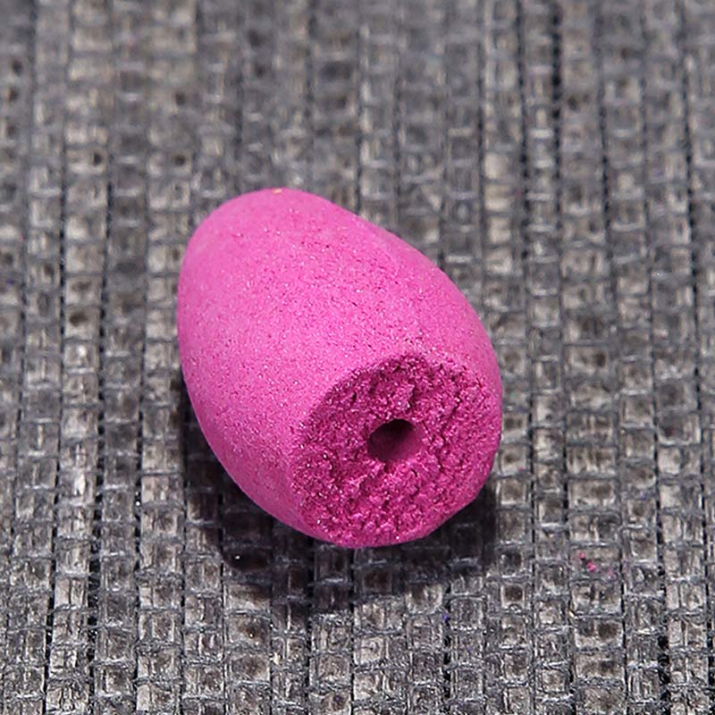Pink foam ball on a textured gray surface