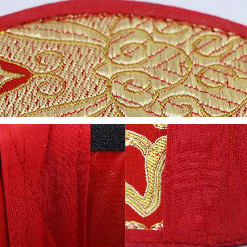 Close-up of red fabric with gold embroidery