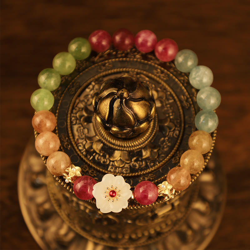 Bracelet with multicolored beads and decorative elements on a decorative stand
