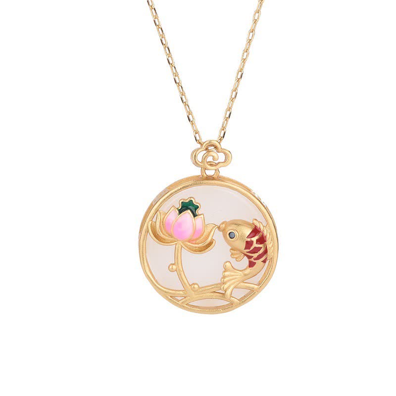 Gold necklace with a round pendant featuring a fish and lotus flower on a white background