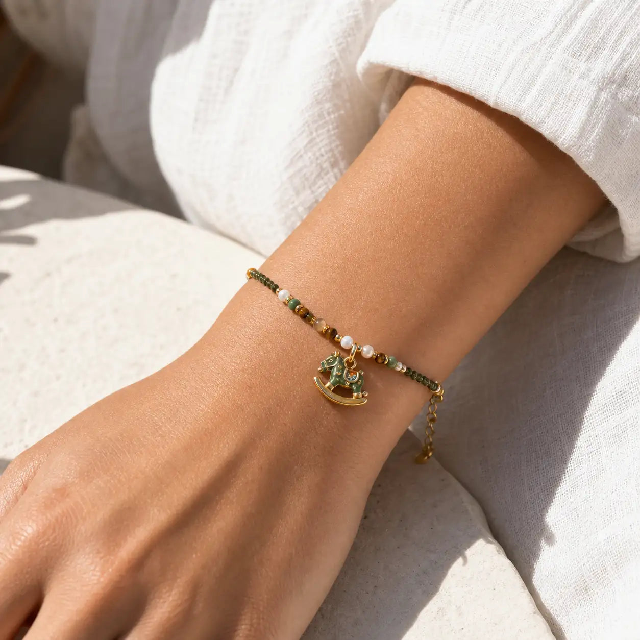 Close-up of Enamel Horse Pearl Bracelet