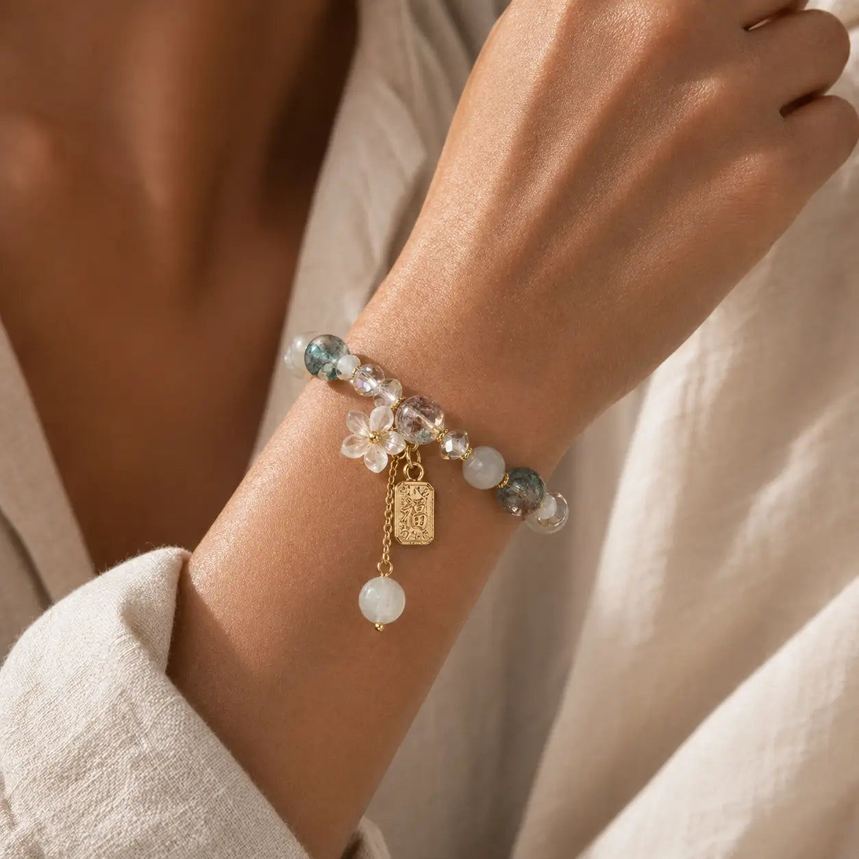 Quiet Fortune Fu Charm Mixed Stone Bracelet worn on wrist with mixed stone beads