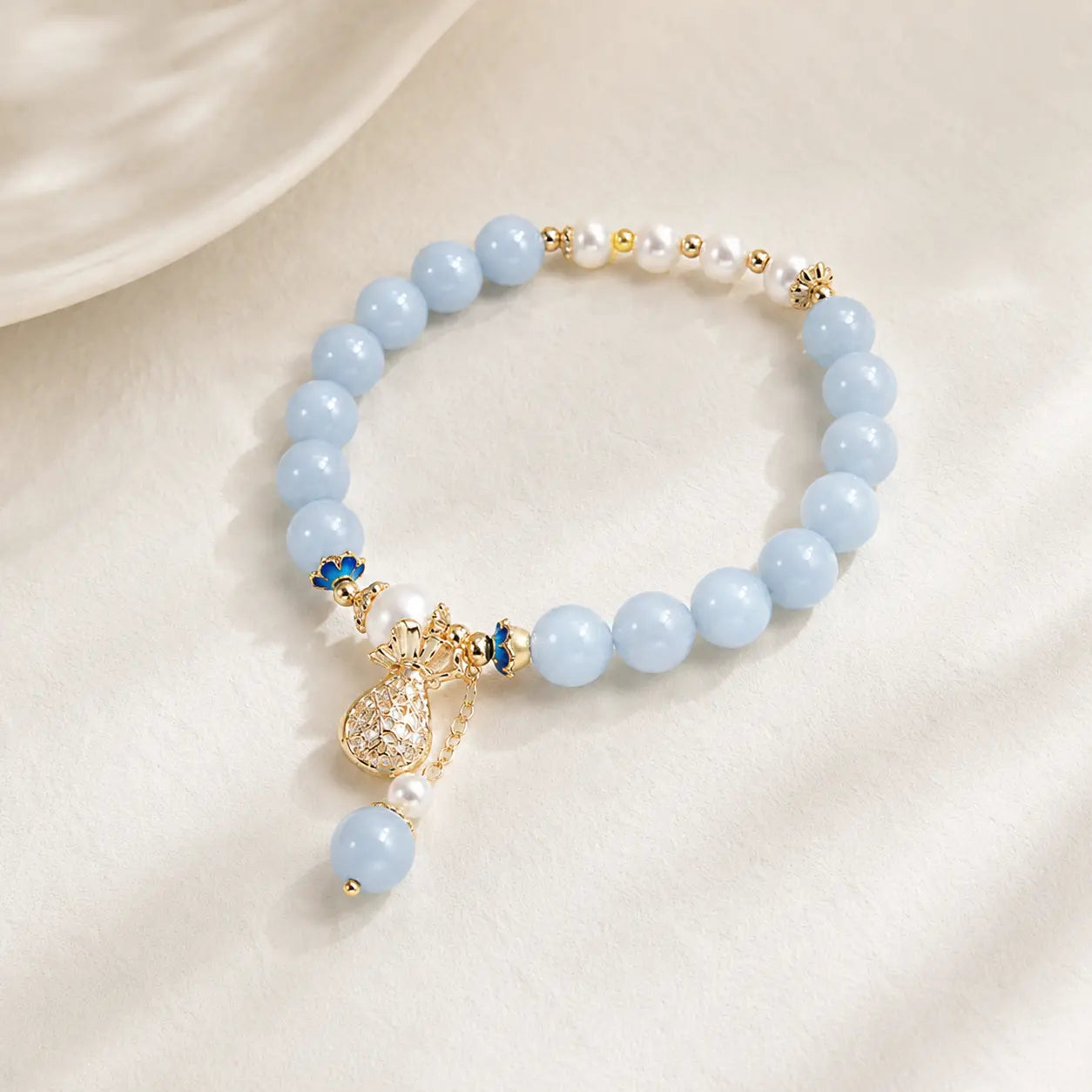 Fu Dai Pearl Blue Stone Bracelet shown from another angle