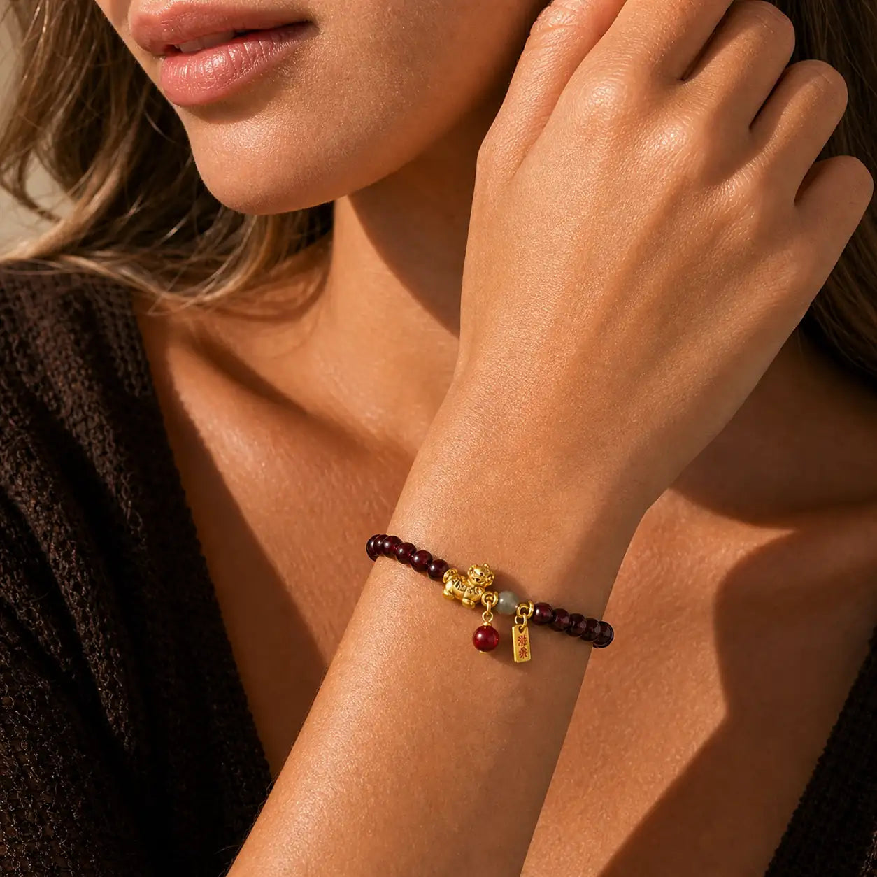 Close-up of Garnet Horse Charm Bracelet with garnet
