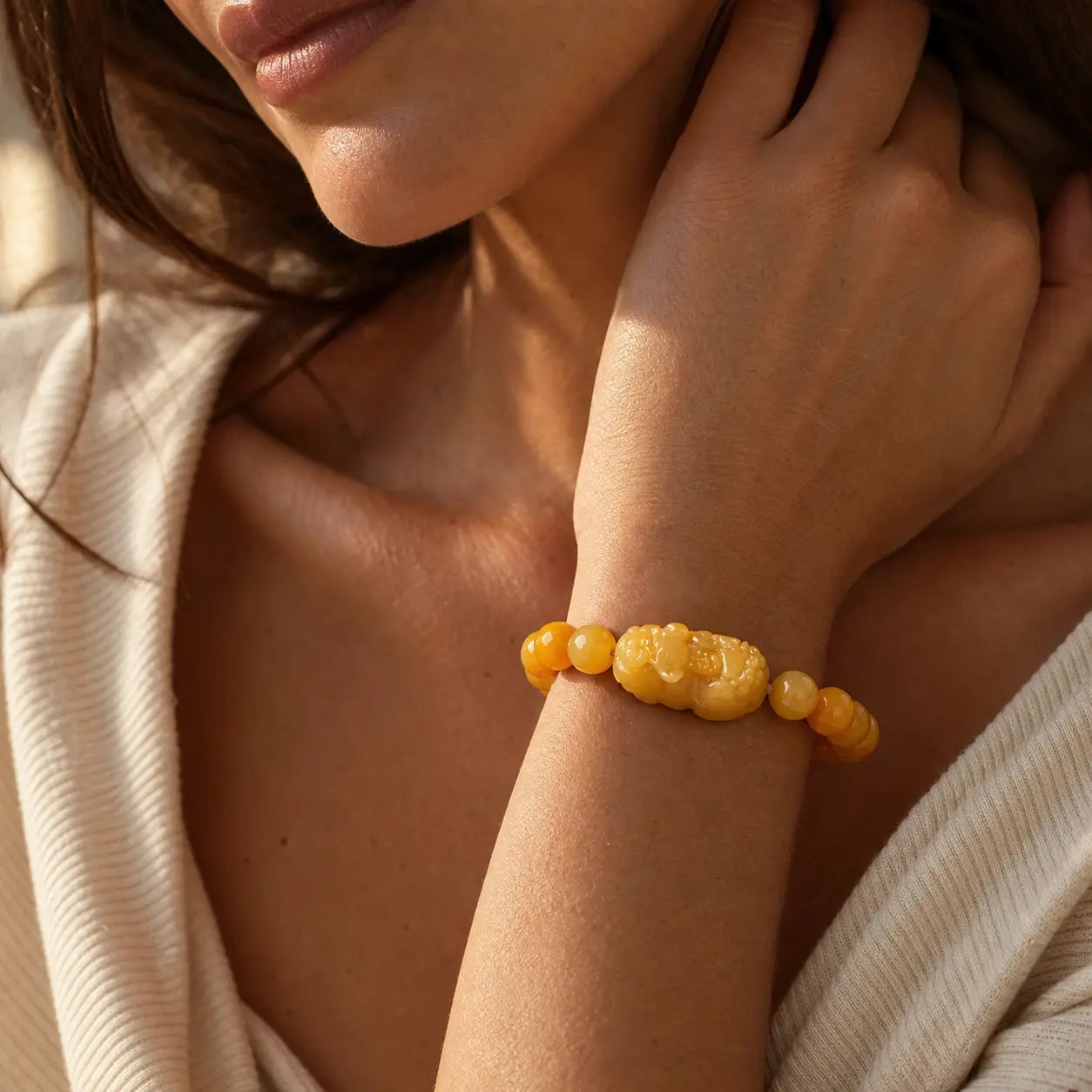 Golden Silk Jade Pixiu Wealth Bracelet worn on wrist with golden jade beads