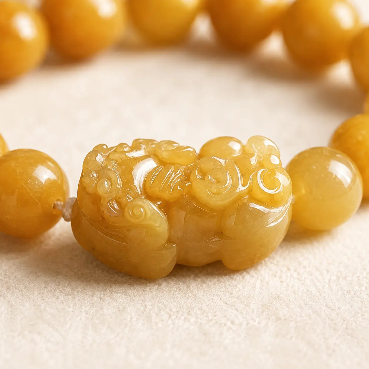 Golden Pixiu Jade Bracelet shown from another angle with pixiu