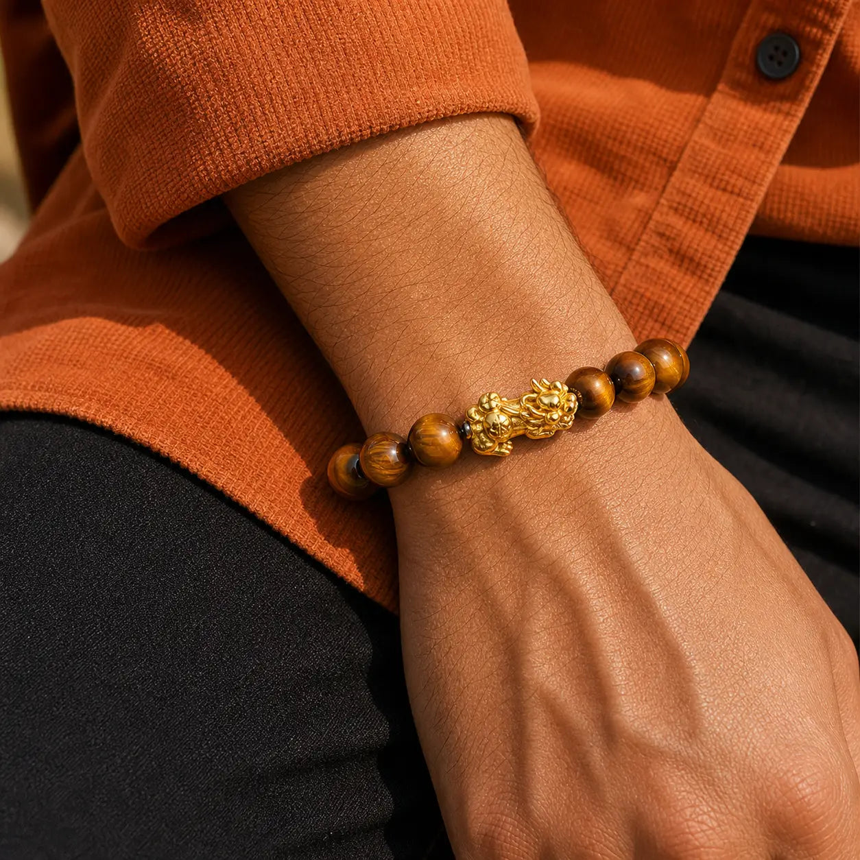 Solar Vigilance Pixiu Bracelet worn on wrist with golden tiger eye beads