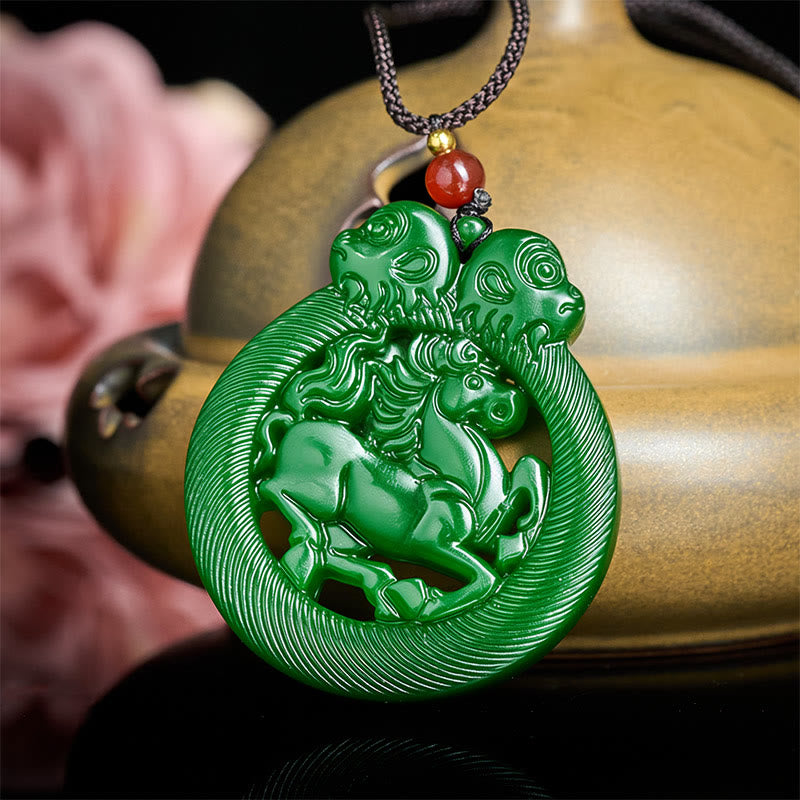 Green jade pendant with unicorn design on a wooden surface