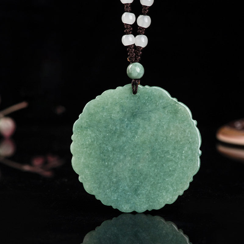 Detail view of Imperial Pulse Jade Dragon Pendant on a dark background