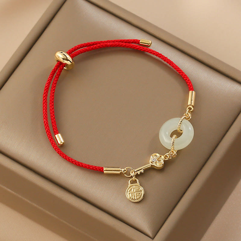 TheFuMaster Wealth Charm Peace Bracelet with Hetian jade and gold accents on red rope, symbolizing fortune and peace